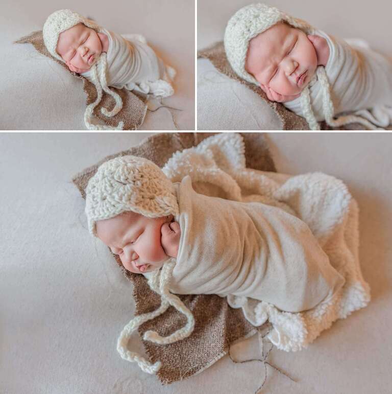 newborn baby girl in cream bonnet