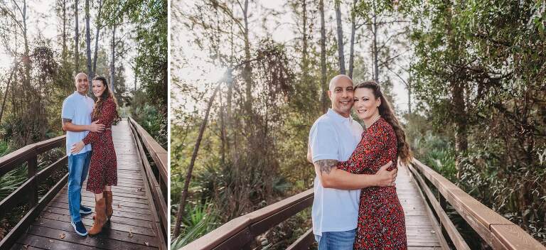 mom and dad on wooden walkway in woods