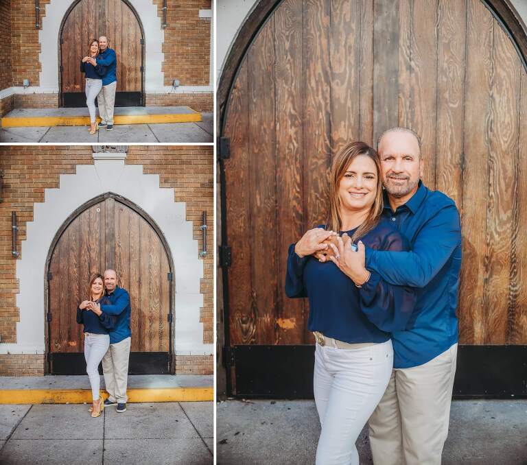 husband and wife in front of big brown door