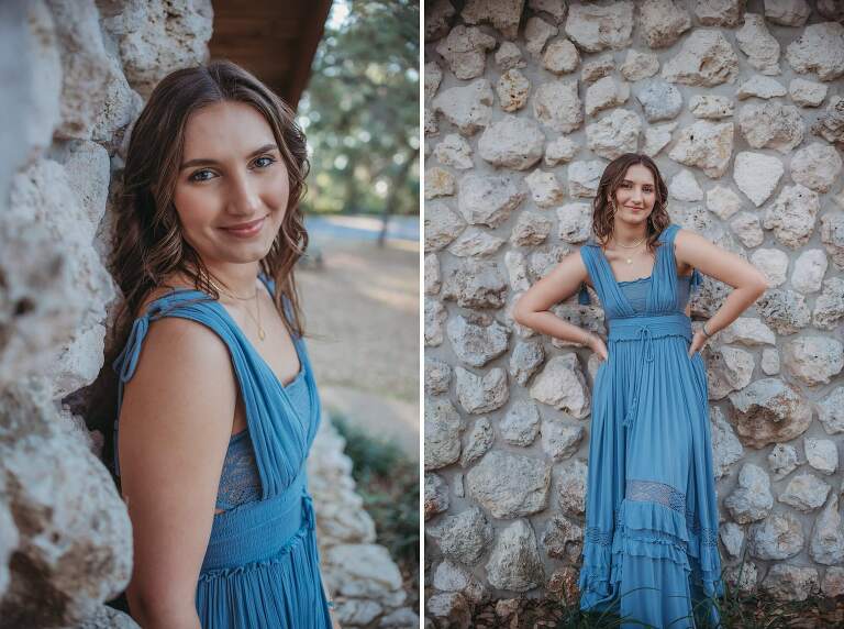 senior girl in beautiful blue dress against stone wall