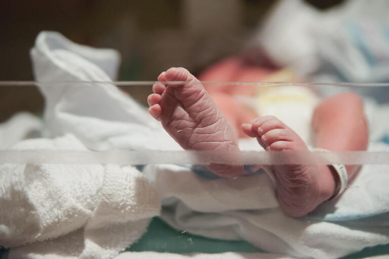 new baby feet, explaining the cost of birth photography